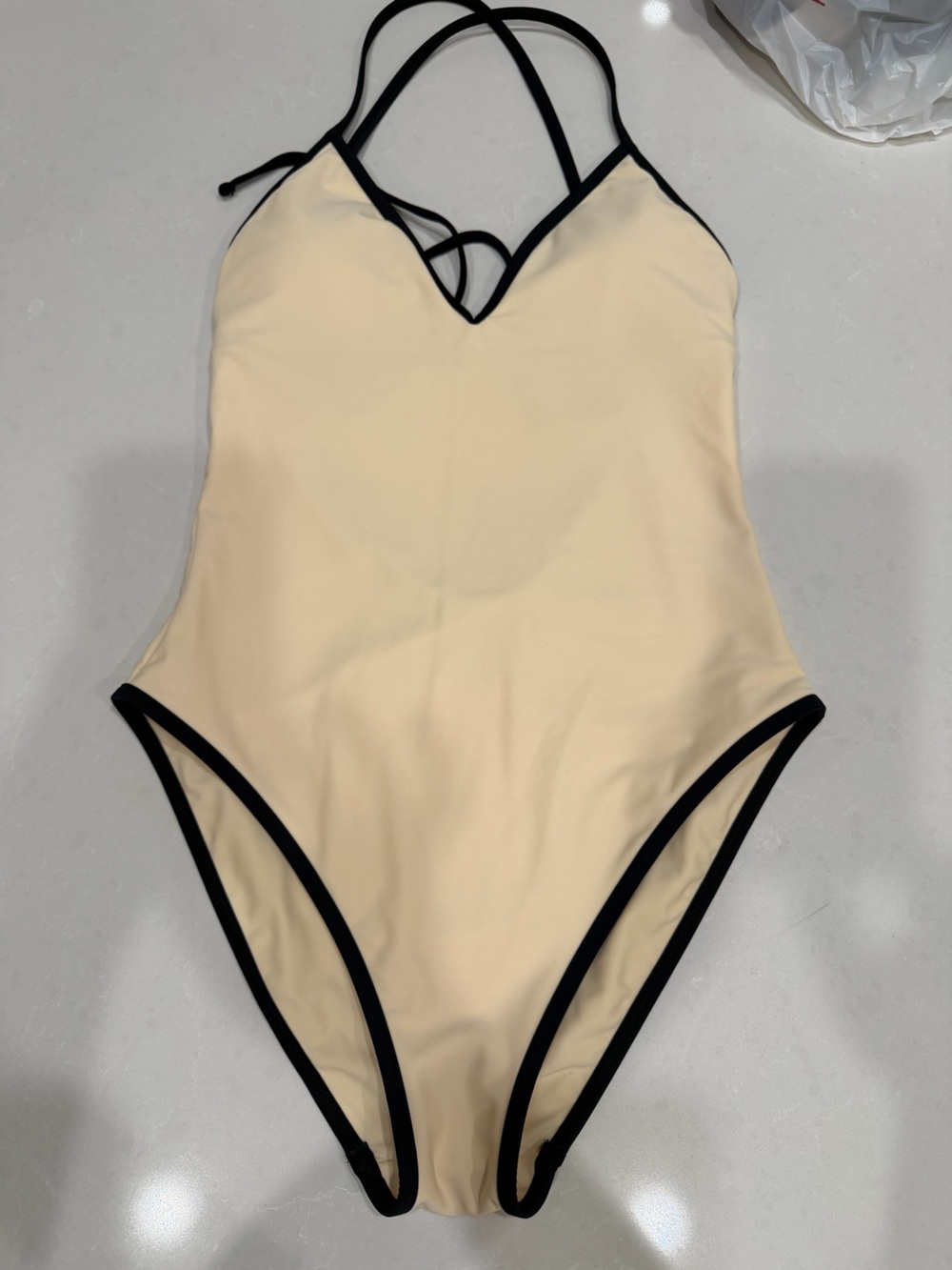 Vince Cream One-Piece with Black Binding